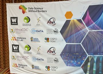 A large poster that says 'Data Science Without Borders' and includes logos of participating organisations including OSPO Now